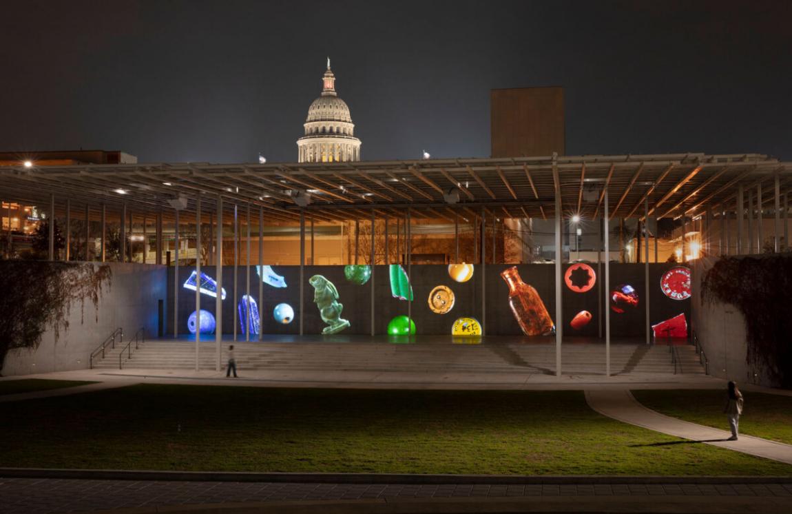screen with artwork at amphitheater with capitol building in background