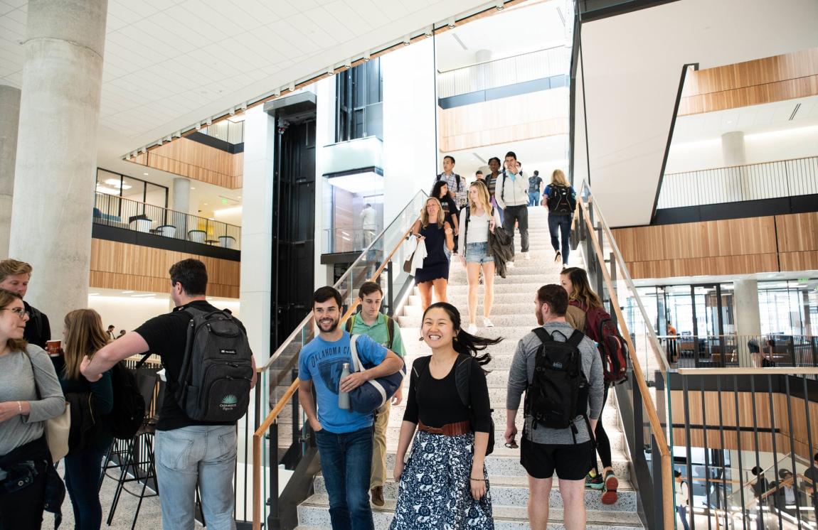 Students walking up and down a staircase