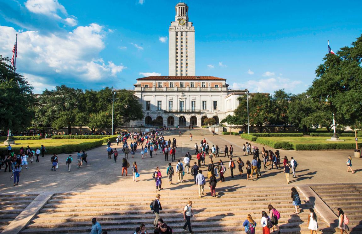 UT Tower aerial view with students walking across the mall