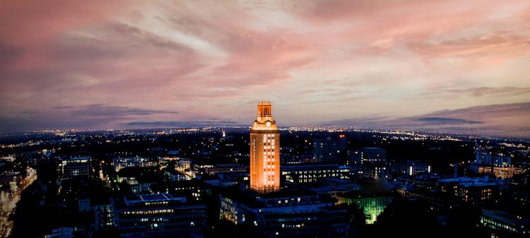 Aerial view of the UT campus centering on S E C letters in the windows of the UT Tower.