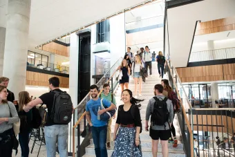 Students on a staircase between classes