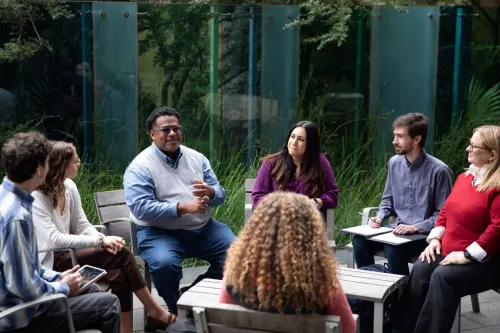 Faculty member with students outdoor class