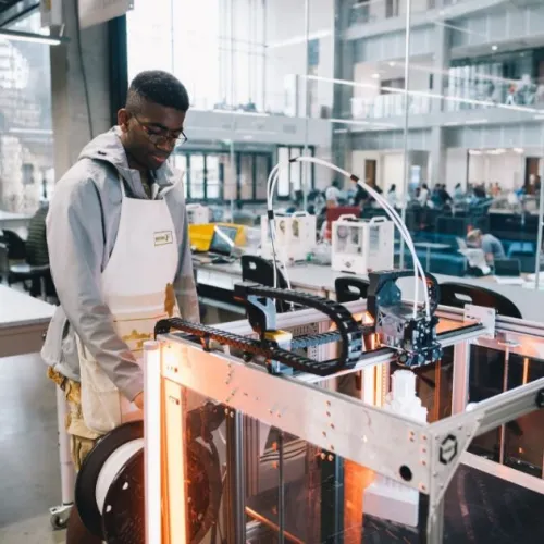 student working at a fabrication lab