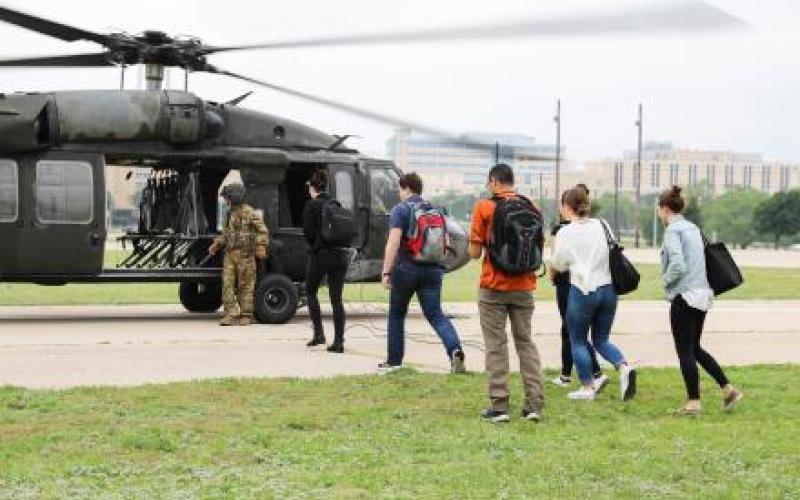 student's boarding a helicopter
